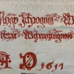 A beautiful shade of red. And color matters. The green color requires wearing gloves. How do you work with an old book?