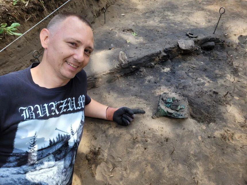 Dr. Andrzej Maciałowicz next to the Celtic helmet. Photo by Dr. Bartłomiej Kaczyński