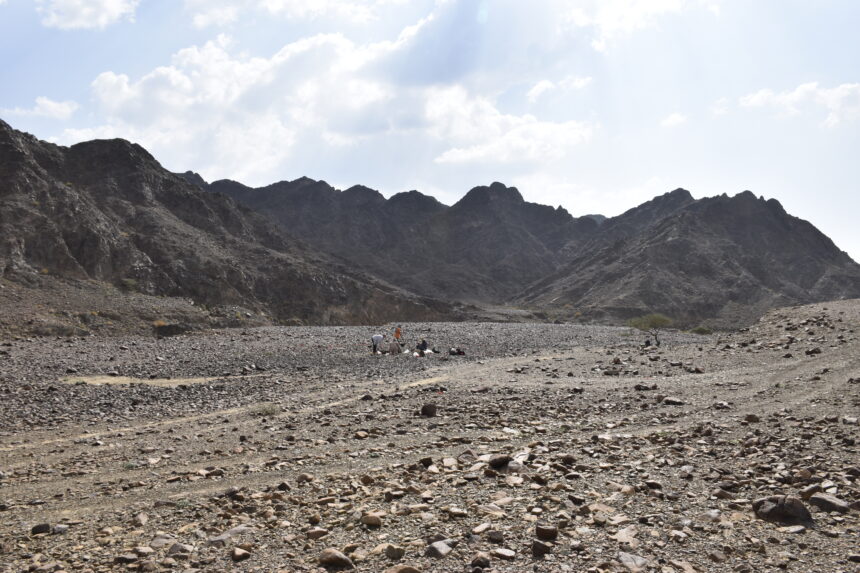 View of the Polish excavation site. The darker surface – where people are standing – is slag.